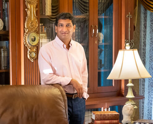 Owner of Rajkamal Palace Owner of Rajkamal Palace in his elegant private library, a prestigious setting for Hyderabad weddings.