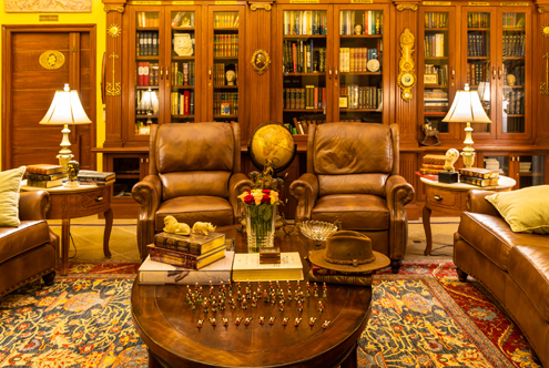 Opulent private library sitting area adorned with antiques, a luxurious touch for your luxury wedding venue.